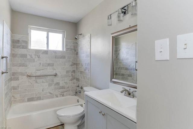 full bathroom featuring washtub / shower combination, vanity, and toilet