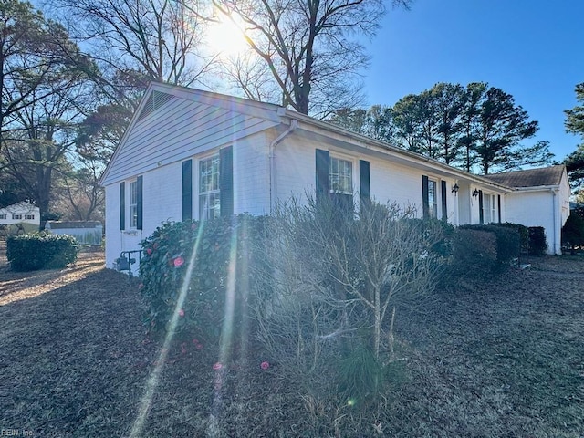 view of home's exterior with brick siding