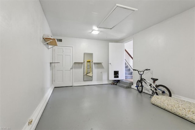 garage with visible vents and baseboards