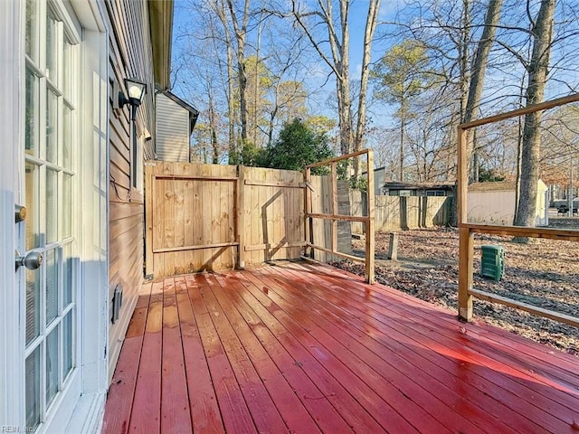 wooden deck featuring a fenced backyard