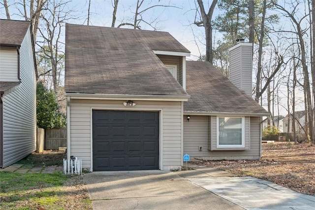 view of front of home featuring a garage, a shingled roof, fence, concrete driveway, and a chimney