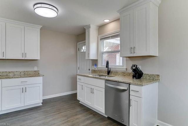 kitchen with a sink, baseboards, white cabinets, stainless steel dishwasher, and dark wood finished floors