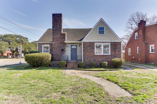 view of front facade with brick siding, a shingled roof, crawl space, a front lawn, and a chimney