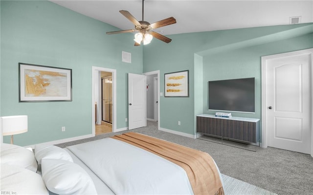 carpeted bedroom featuring lofted ceiling, visible vents, a ceiling fan, connected bathroom, and baseboards