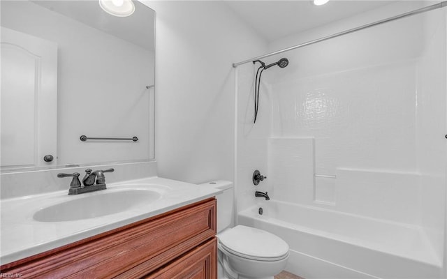 bathroom with tub / shower combination, vanity, and toilet