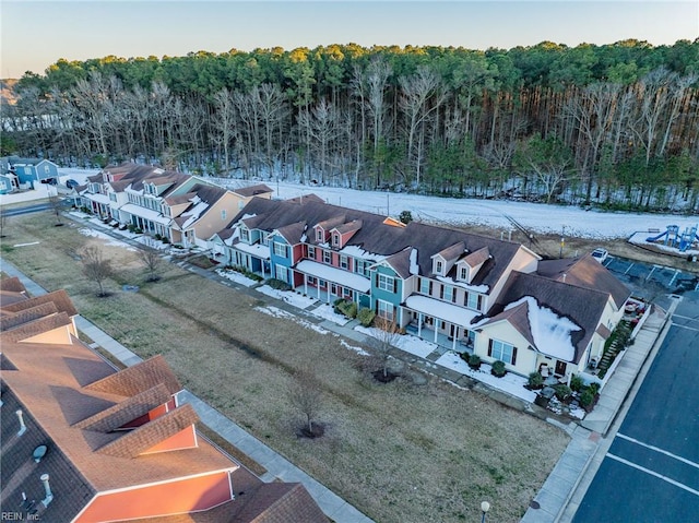 birds eye view of property with a forest view and a residential view