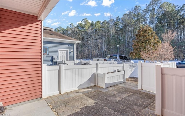 view of patio / terrace featuring fence