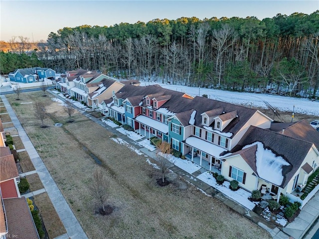 birds eye view of property featuring a residential view and a view of trees