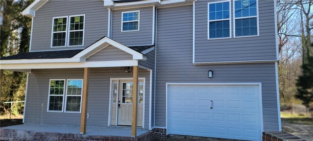 view of front of property with a garage