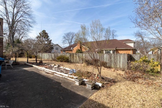 view of yard featuring a patio and a fenced backyard