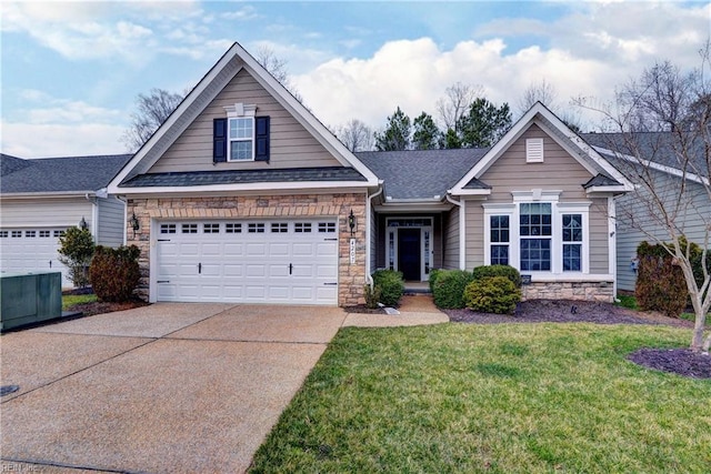 view of front of property with a garage, driveway, a front lawn, and stone siding