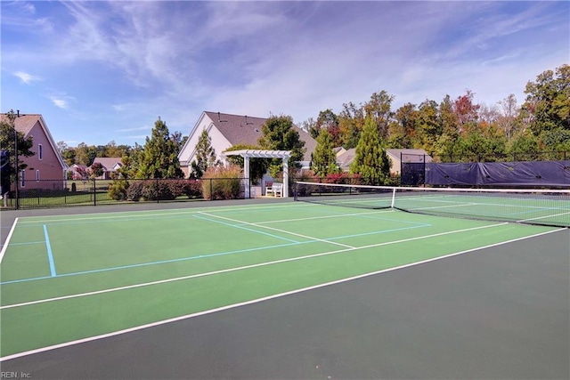 view of sport court featuring community basketball court, fence, and a pergola