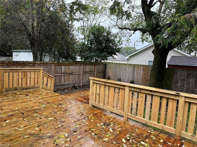 deck with a fenced backyard