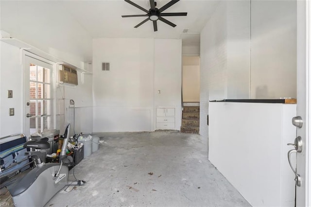 interior space with ceiling fan, unfinished concrete floors, and visible vents