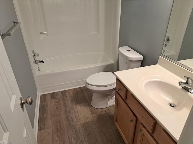 full bathroom featuring shower / tub combination, vanity, toilet, and wood finished floors