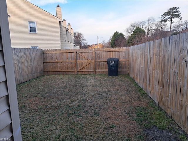 view of yard with a fenced backyard