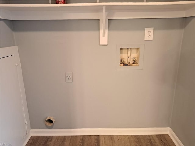 laundry area with hookup for a washing machine, electric dryer hookup, baseboards, and wood finished floors