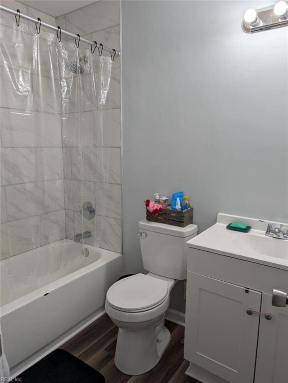 bathroom with shower / bathtub combination with curtain, toilet, wood finished floors, and vanity