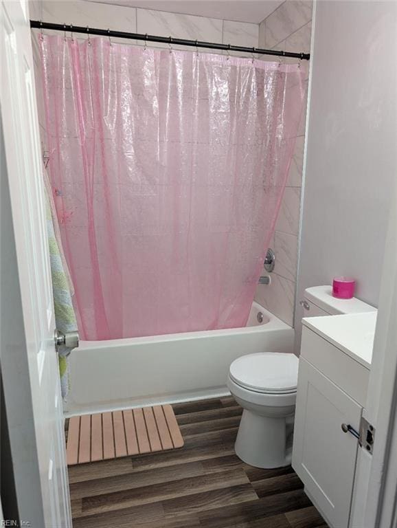 full bathroom with vanity, toilet, shower / tub combo, and wood finished floors