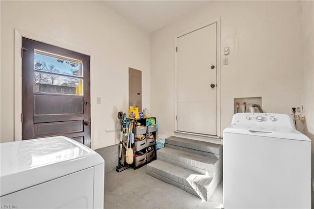 washroom featuring washer and dryer, laundry area, and electric panel