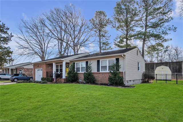 view of front facade with a front yard, crawl space, fence, and an attached garage