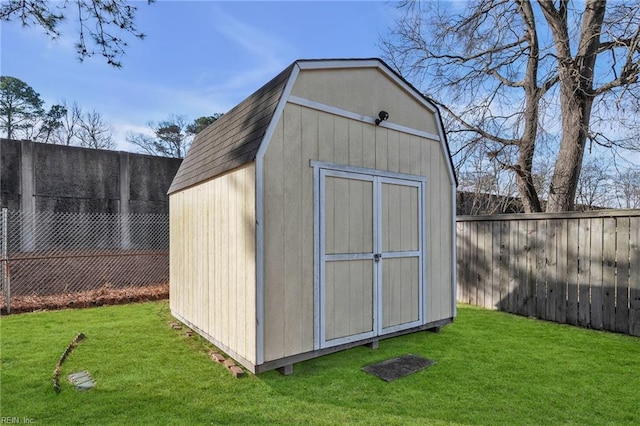 view of shed featuring a fenced backyard