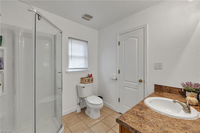 full bath featuring visible vents, toilet, tile patterned flooring, a shower stall, and a sink