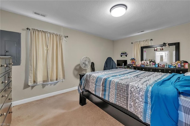 bedroom with baseboards, carpet, visible vents, and a textured ceiling