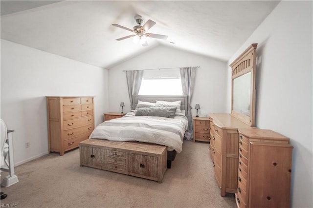 bedroom featuring lofted ceiling, light carpet, and a ceiling fan