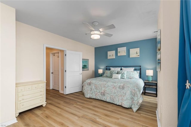 bedroom with a ceiling fan and wood finished floors