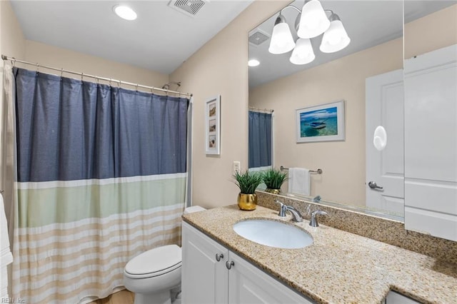 bathroom with toilet, a shower with curtain, visible vents, and vanity