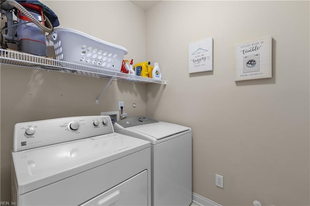 laundry area with laundry area and washer and clothes dryer