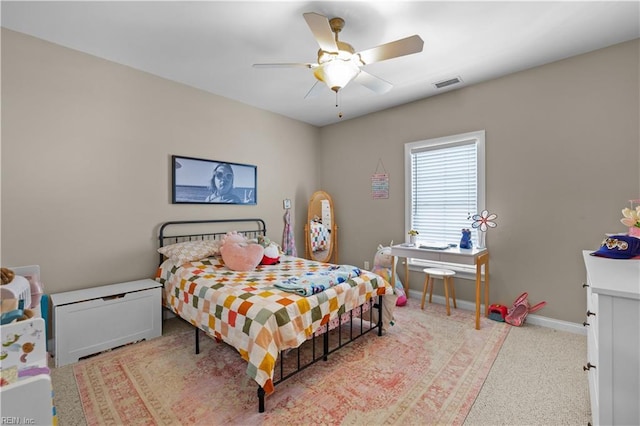 bedroom with a ceiling fan, visible vents, and baseboards