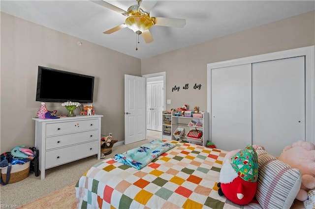 bedroom featuring carpet floors, a closet, and a ceiling fan