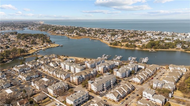 bird's eye view featuring a water view and a residential view