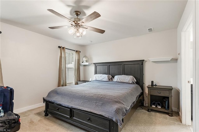 bedroom with light carpet, visible vents, ceiling fan, and baseboards