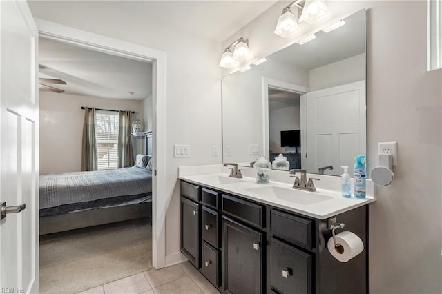 bathroom with double vanity, tile patterned floors, ensuite bath, and a sink