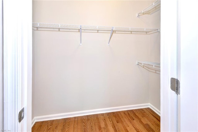 spacious closet with wood finished floors