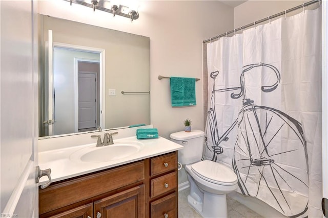 full bathroom featuring vanity, toilet, and tile patterned floors