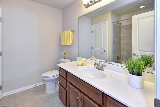 full bath featuring a shower, toilet, vanity, baseboards, and tile patterned floors