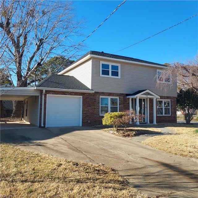 traditional home with a garage, a carport, concrete driveway, and brick siding