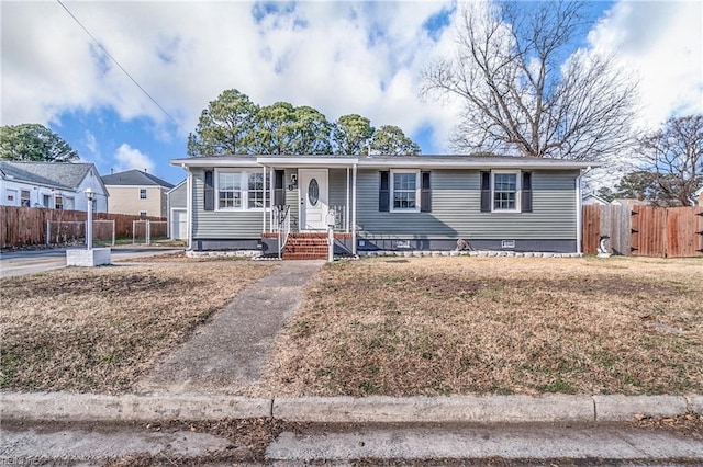 view of front of property featuring crawl space and fence