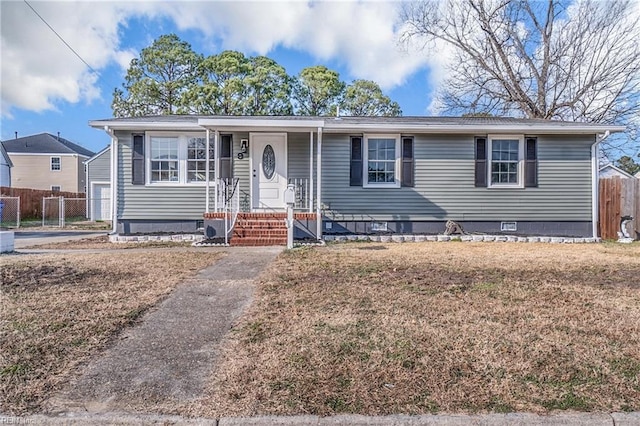 view of front facade featuring a front lawn, crawl space, and fence