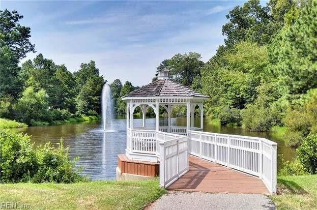 view of dock featuring a water view and a gazebo