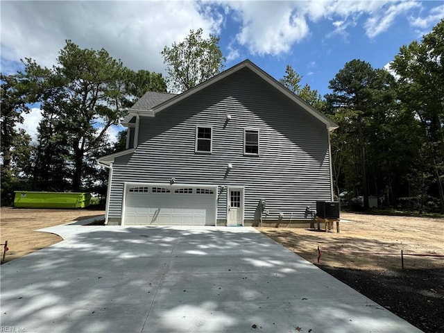 view of home's exterior with driveway and an attached garage