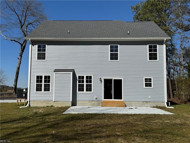 back of house with a yard, entry steps, a patio, and central AC unit
