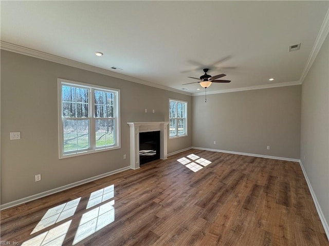unfurnished living room featuring a fireplace, wood finished floors, visible vents, and baseboards