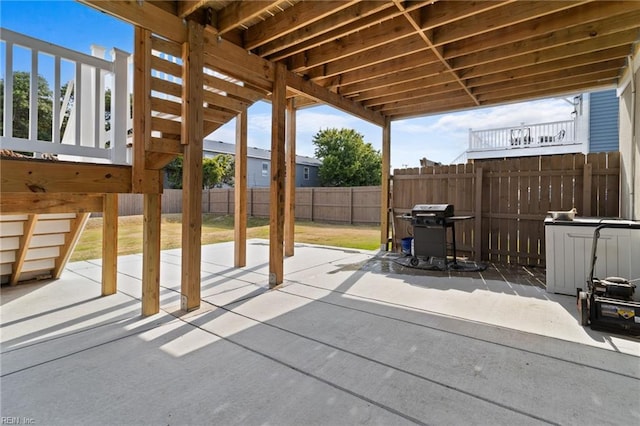 view of patio featuring fence and grilling area