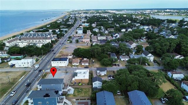 drone / aerial view with a water view and a residential view