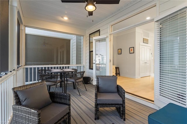 interior space with visible vents and a ceiling fan